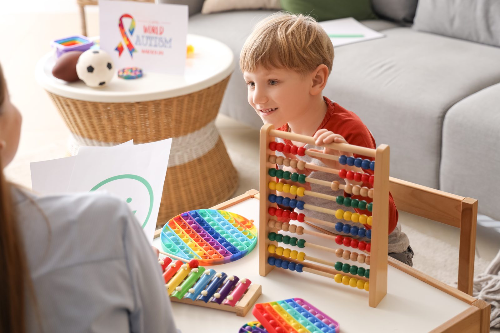 Child engaged in learning activity during therapy