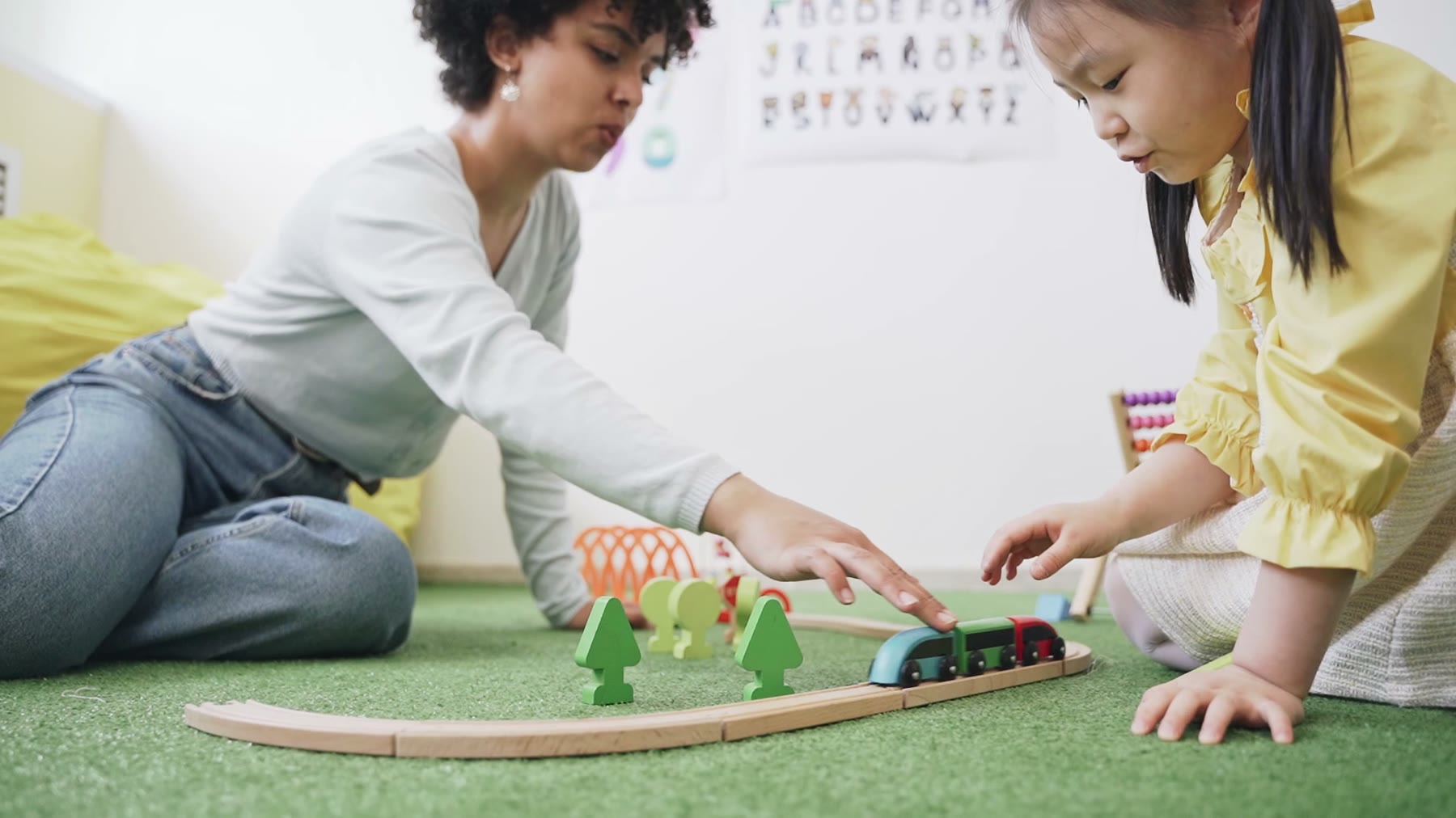 Therapist supporting a child during a play-based session