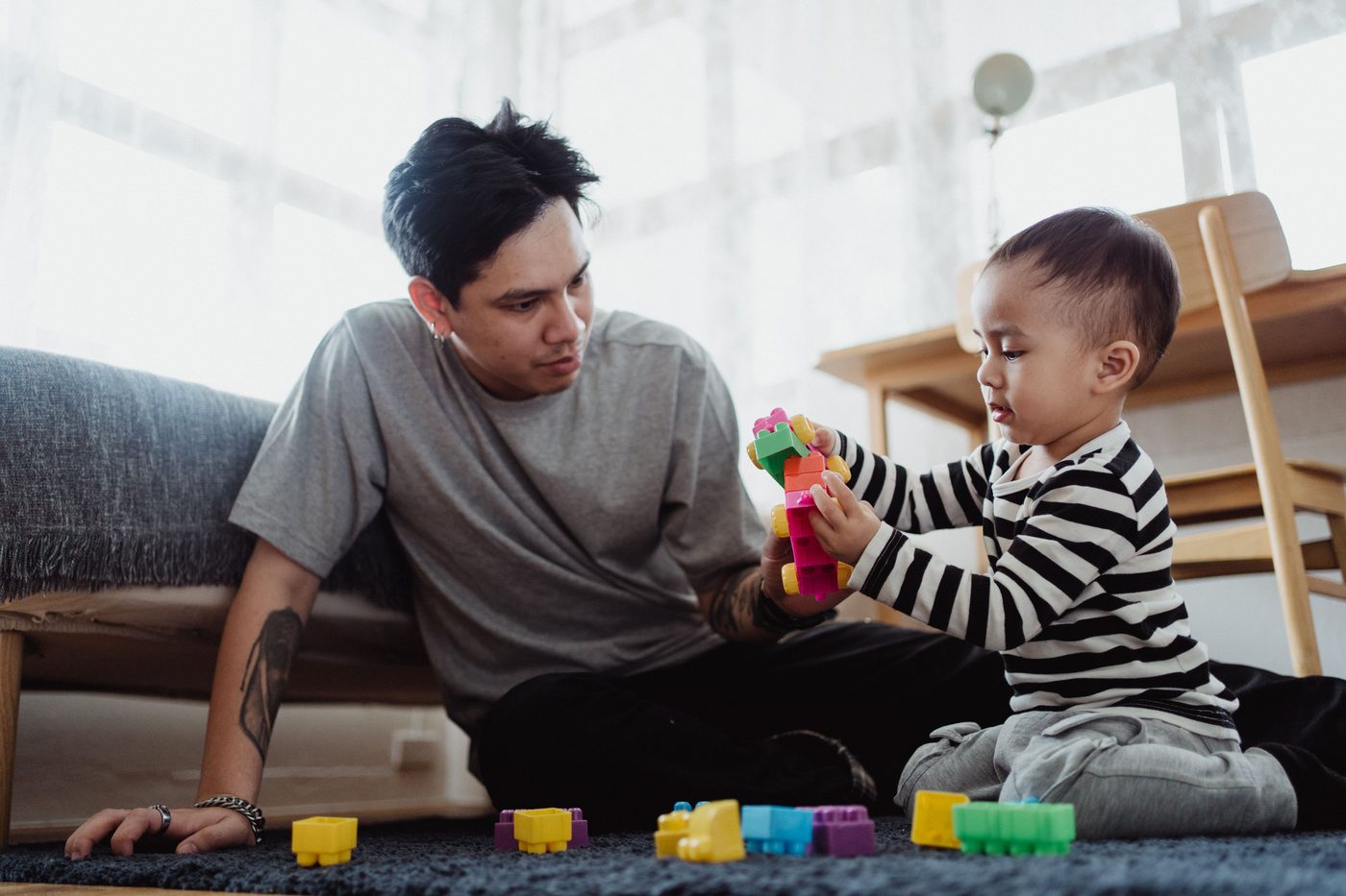 A father and son enjoy quality time indoors