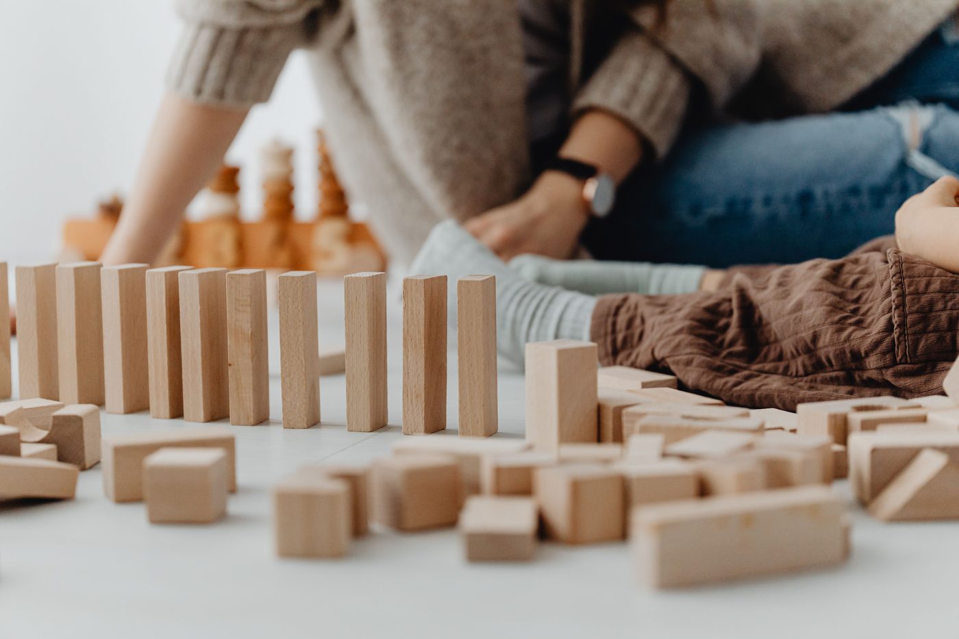 A child playing with wooden blocks indoors