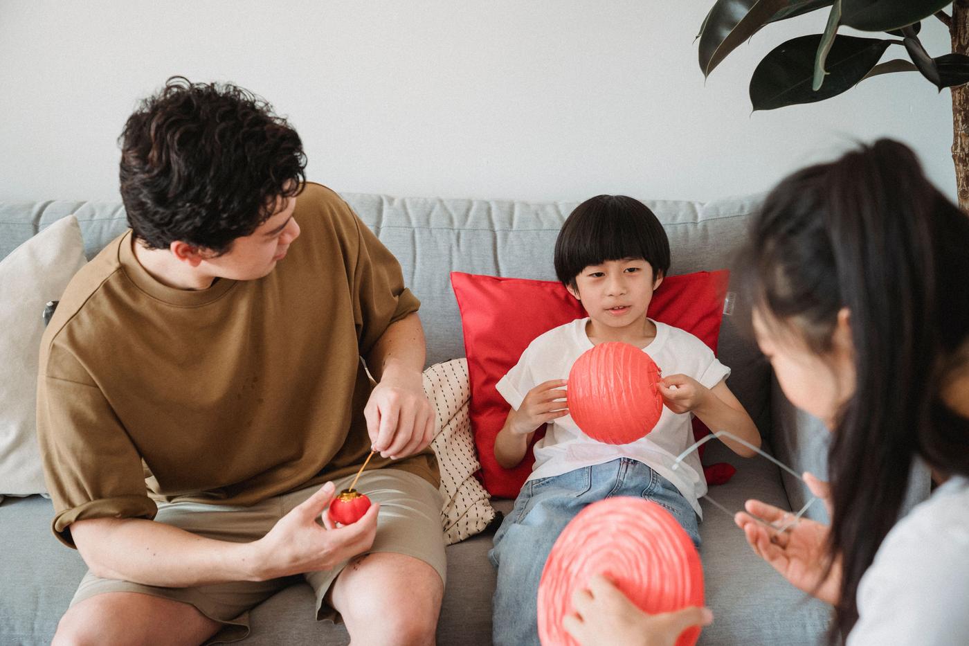 Cheerful family enjoying art and craft activities together indoors