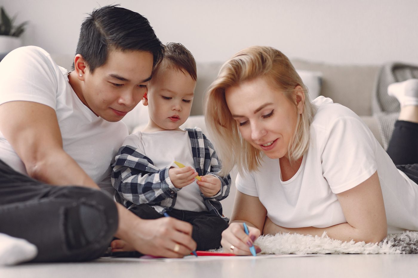 A family enjoys a fun and creative bonding session with drawing activities indoors