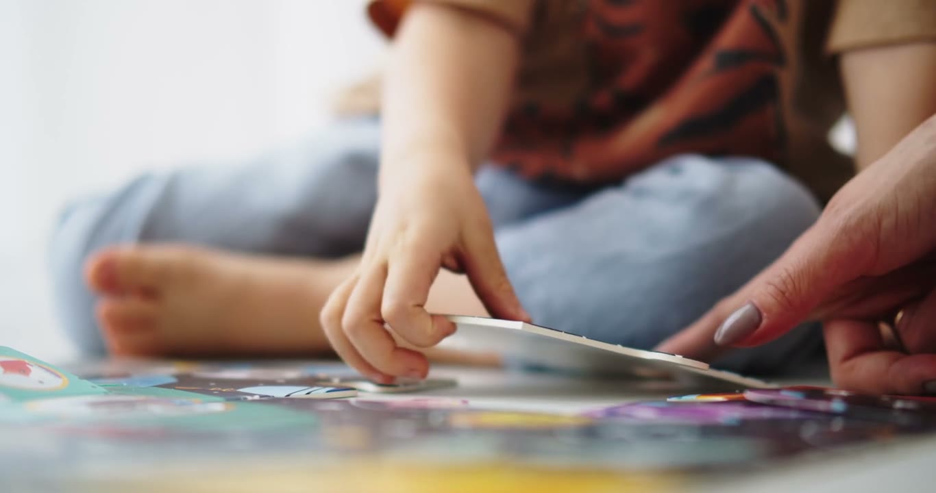 Child practicing a learning activity with a shape sorter