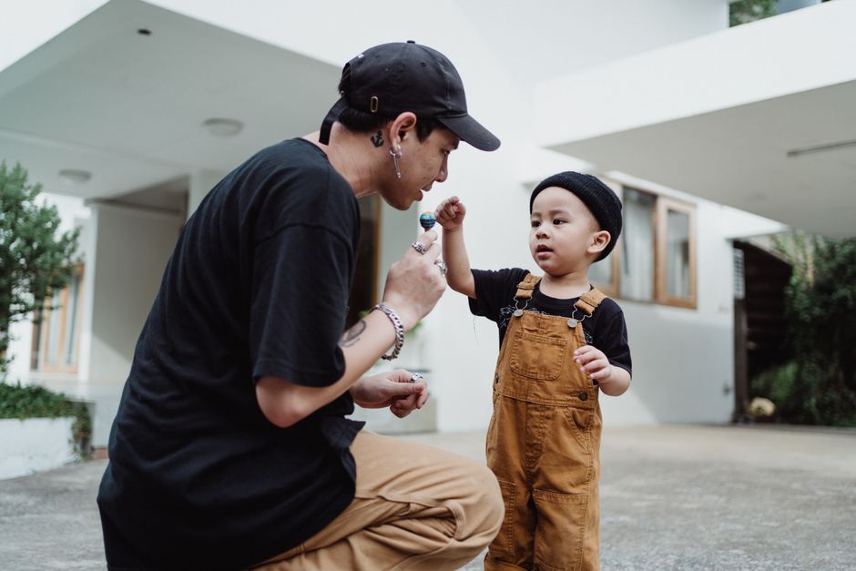 Parent kneeling to talk at eye level with their child