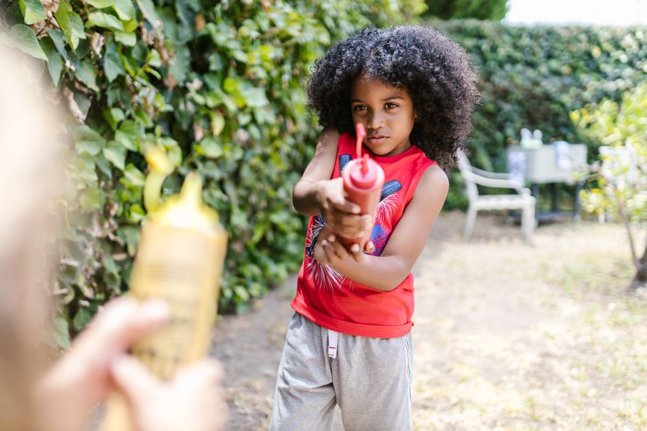 Energetic child playing actively outdoors