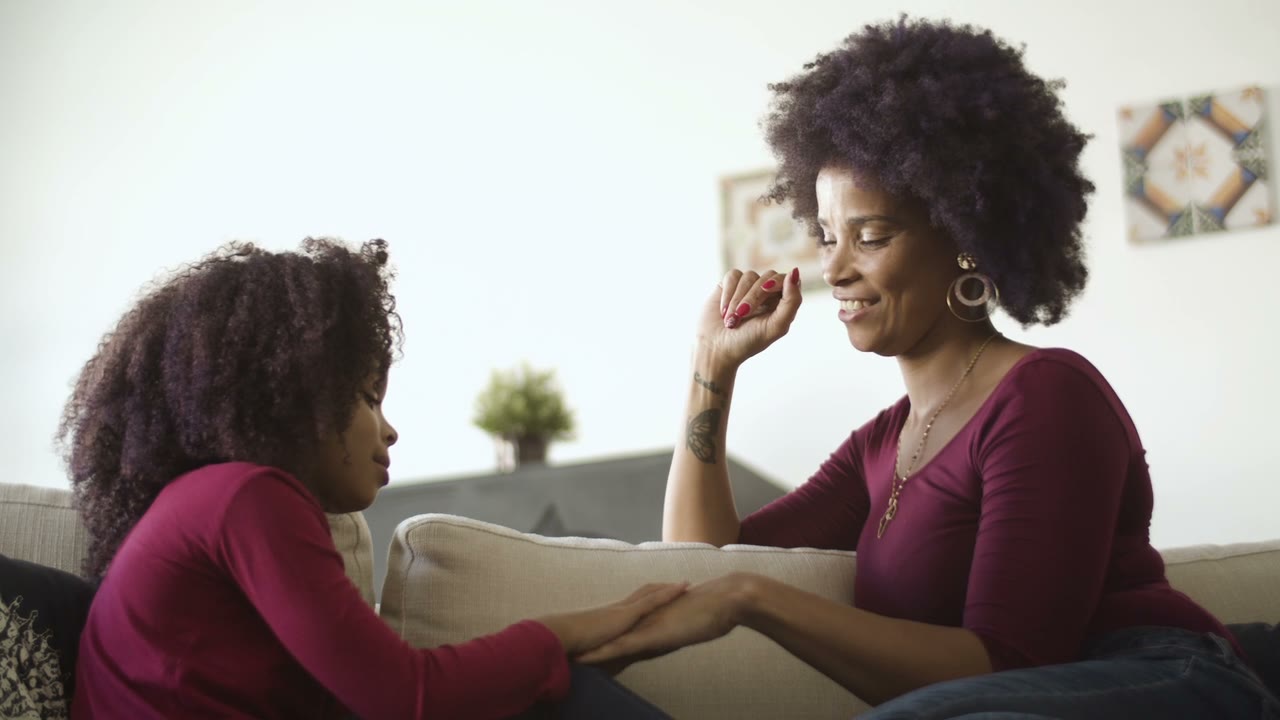 Parent calmly supporting a child during play