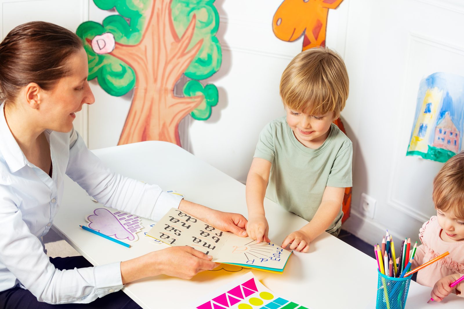 Therapist working on communication skills with children